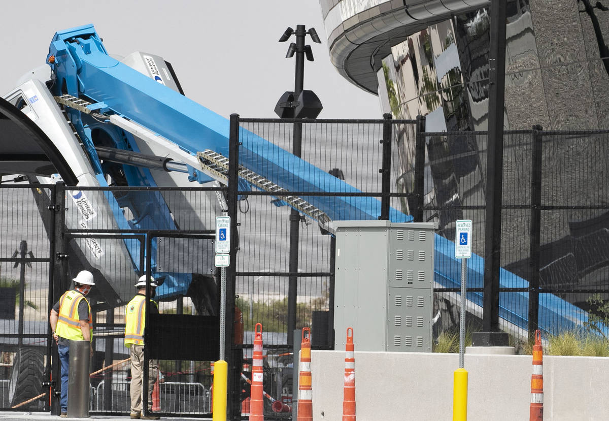 A boom lift lays on its side on the exterior of Allegiant Stadium in Las Vegas on Thursday, Aug ...