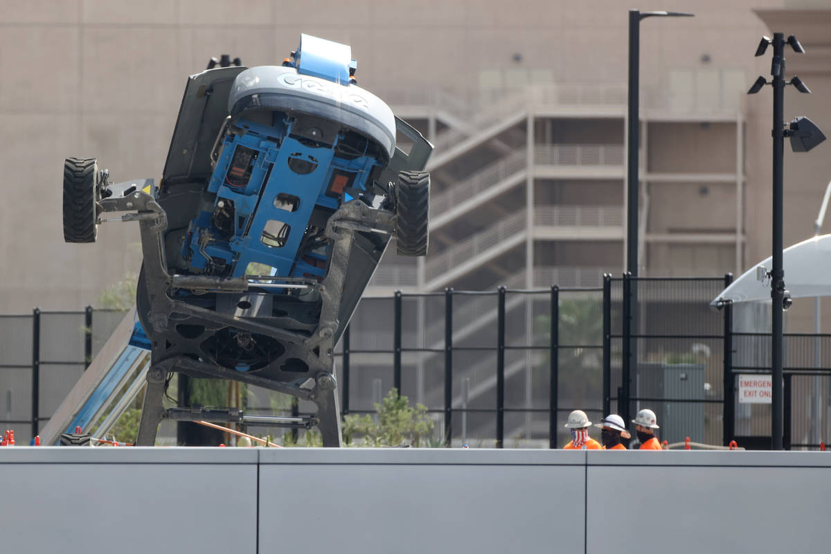 A boom lift lays on its side on the exterior of Allegiant Stadium in Las Vegas, Thursday, Aug. ...