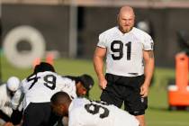 Las Vegas Raiders defensive tackle Mike Panasiuk (91) stretches during an NFL football training ...
