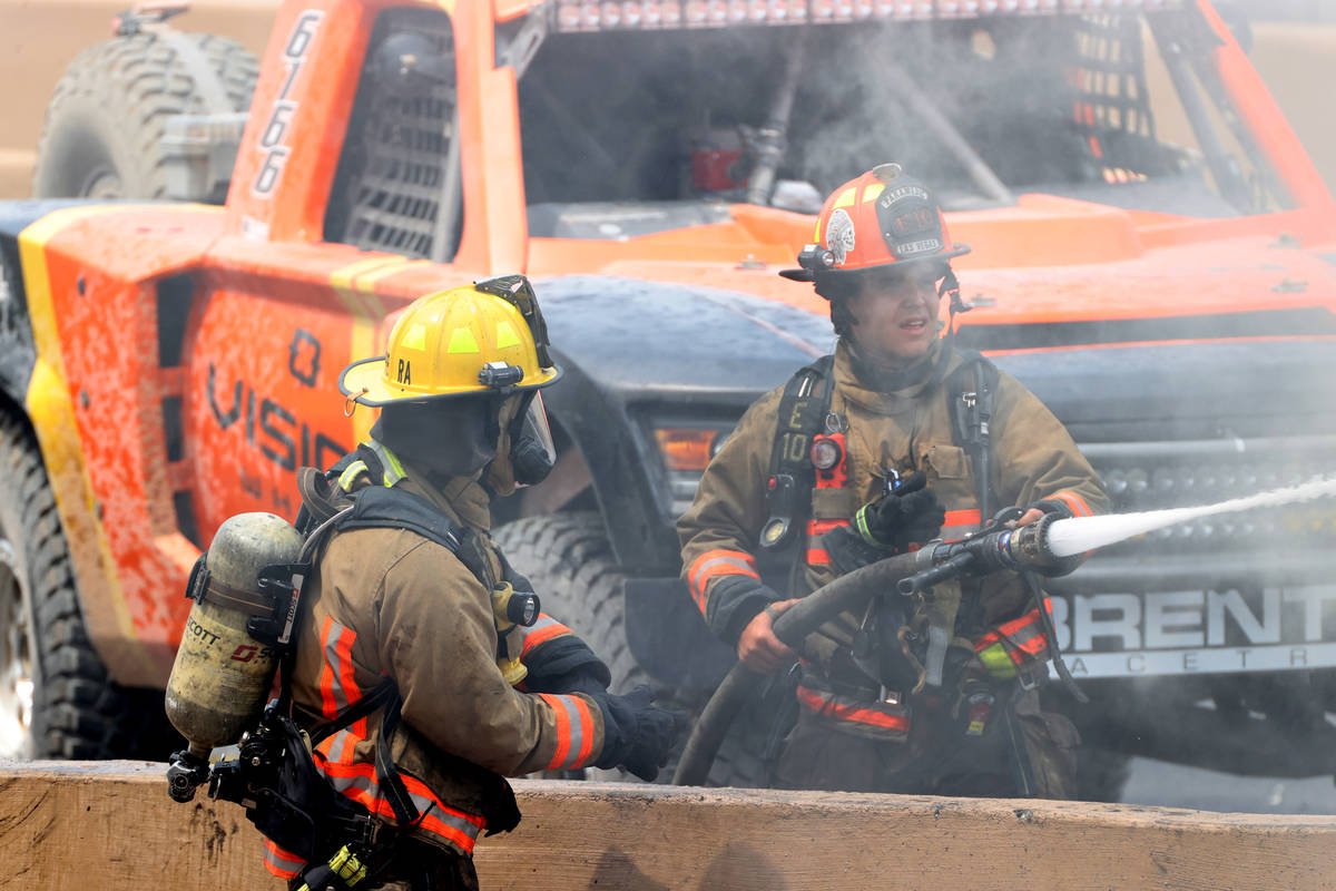 Firefighters put out a vehicle fire involved in a fatal crash on northbound Interstate 15 near ...