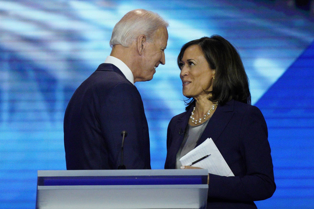 Joe Biden and Sen. Kamala Harris, D-Calif., shake hands after a Democratic presidential primary ...