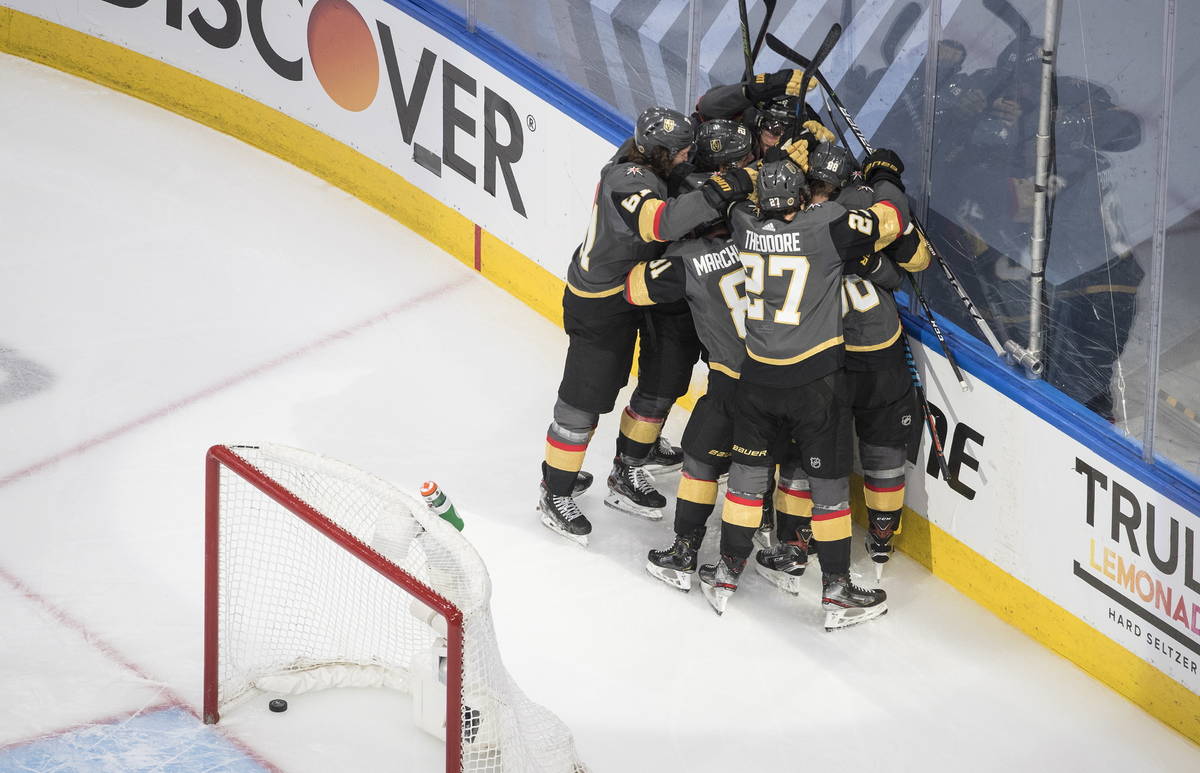 Vegas Golden Knights players celebrate the win over the Chicago Blackhawks after an NHL hockey ...