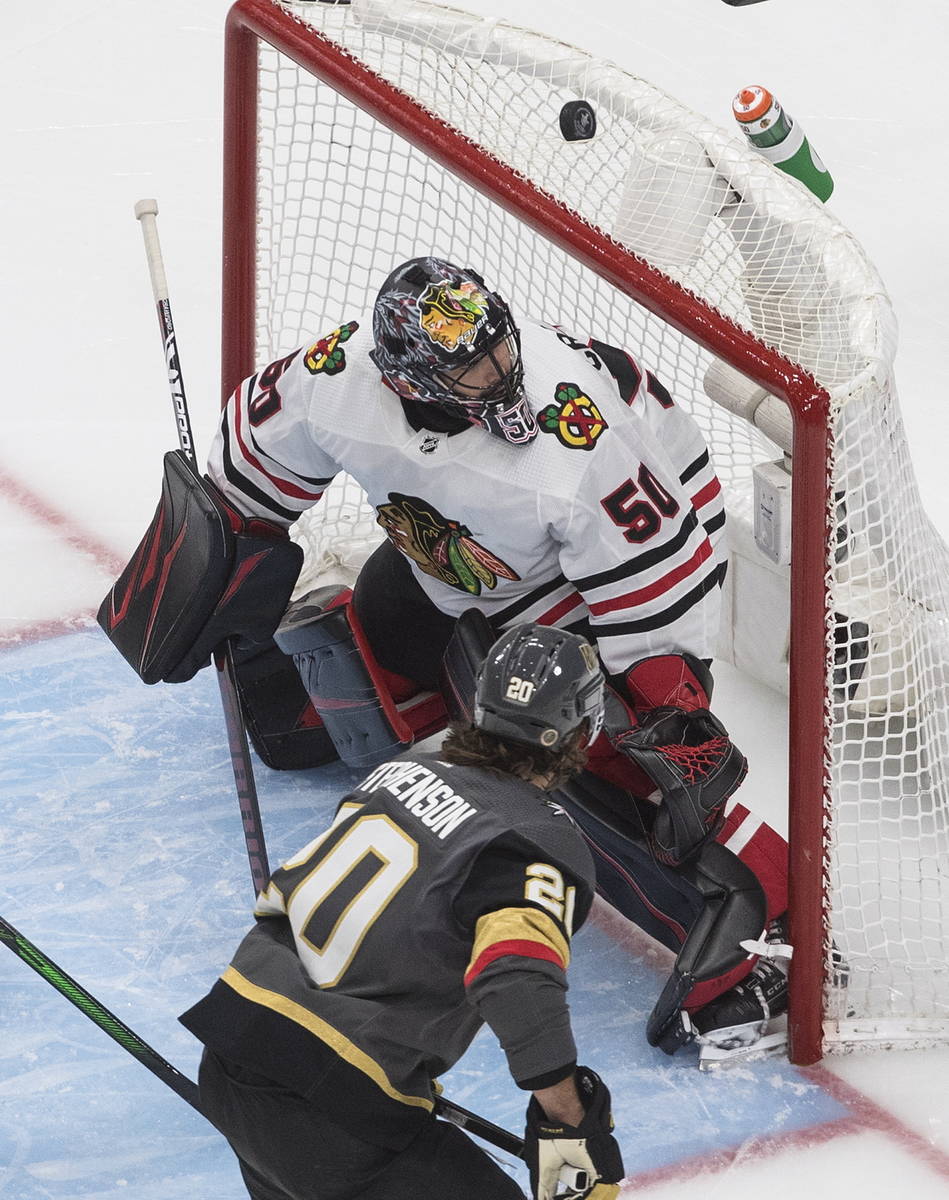 Vegas Golden Knights' Chandler Stephenson (20) watches the puck roll over the net as Chicago Bl ...
