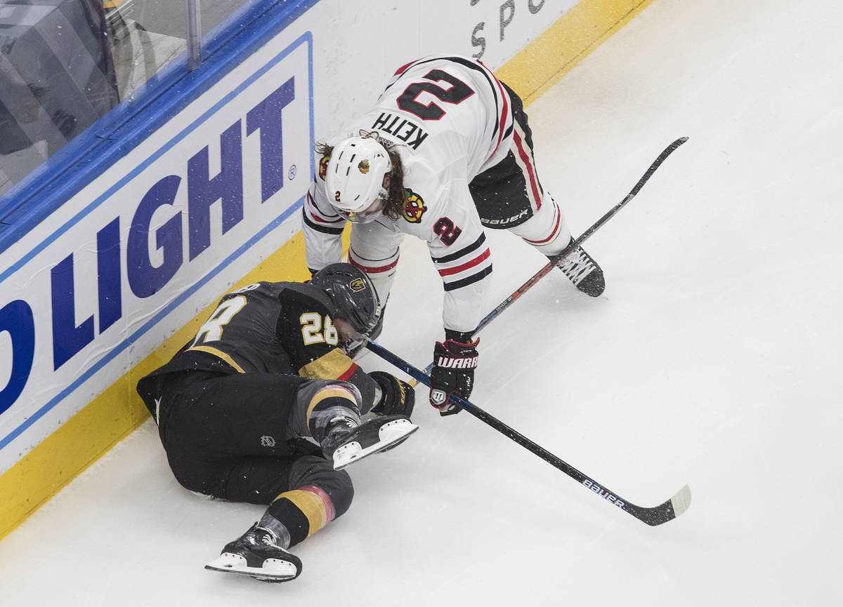 Vegas Golden Knights' Paul Stastny (26) is checked by Chicago Blackhawks' Duncan Keith (2) duri ...