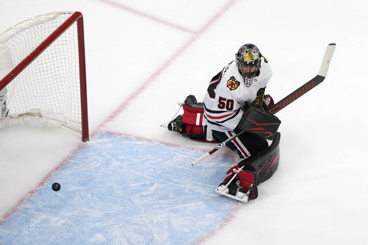 Chicago Blackhawks goalie Corey Crawford (50) is scored against by the Vegas Golden Knights dur ...