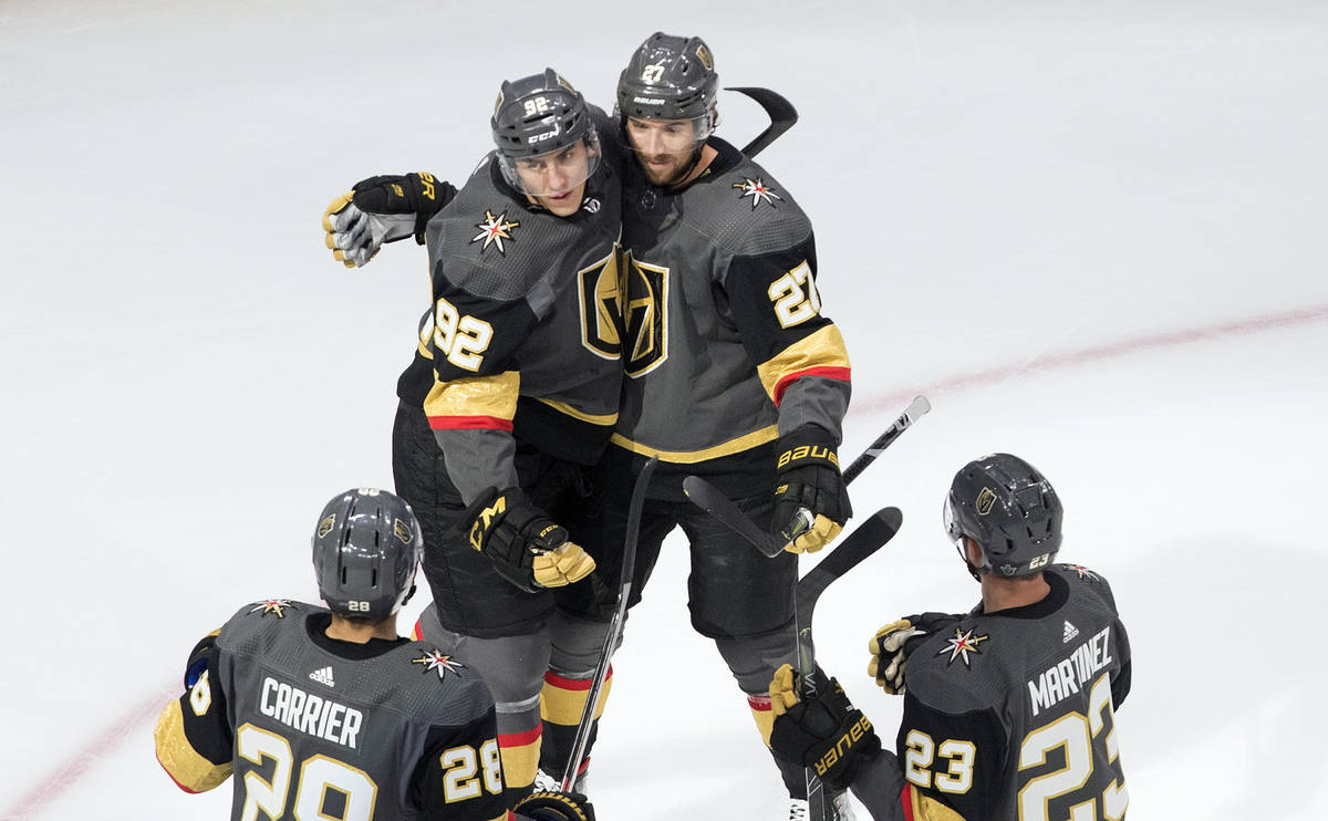 Vegas Golden Knights' Tomas Nosek (92), Shea Theodore (27), William Carrier (28) and Alec Marti ...