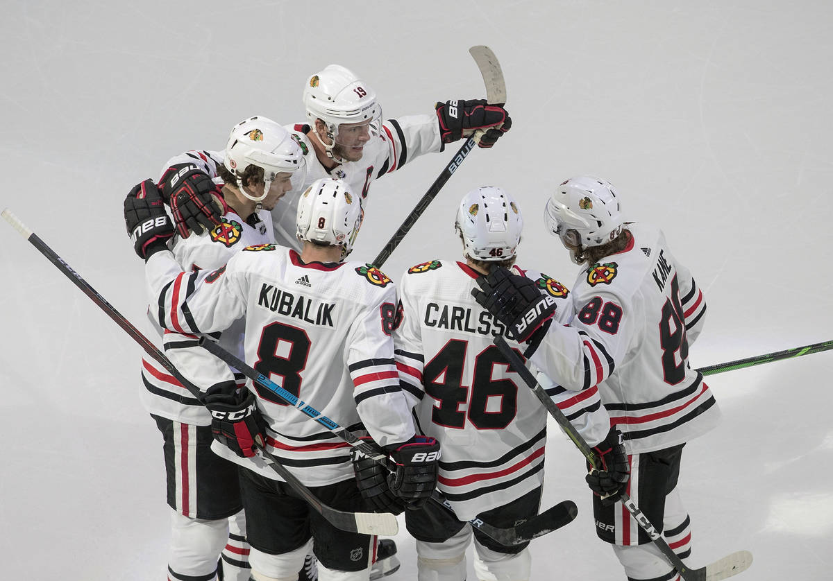 Chicago Blackhawks players celebrate a goal against the Vegas Golden Knights during the second ...