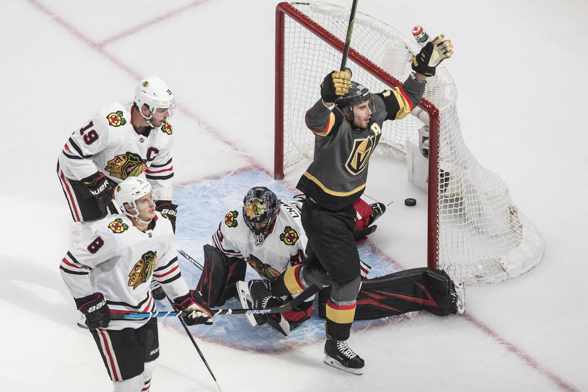 Vegas Golden Knights' Reilly Smith (19) scores on Chicago Blackhawks goalie Corey Crawford (50) ...