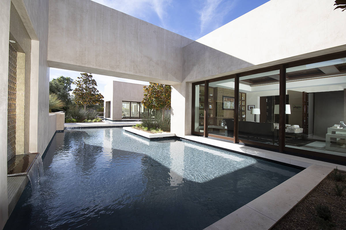 The office opens to the pool. (Synergy Sotheby’s International Realty)