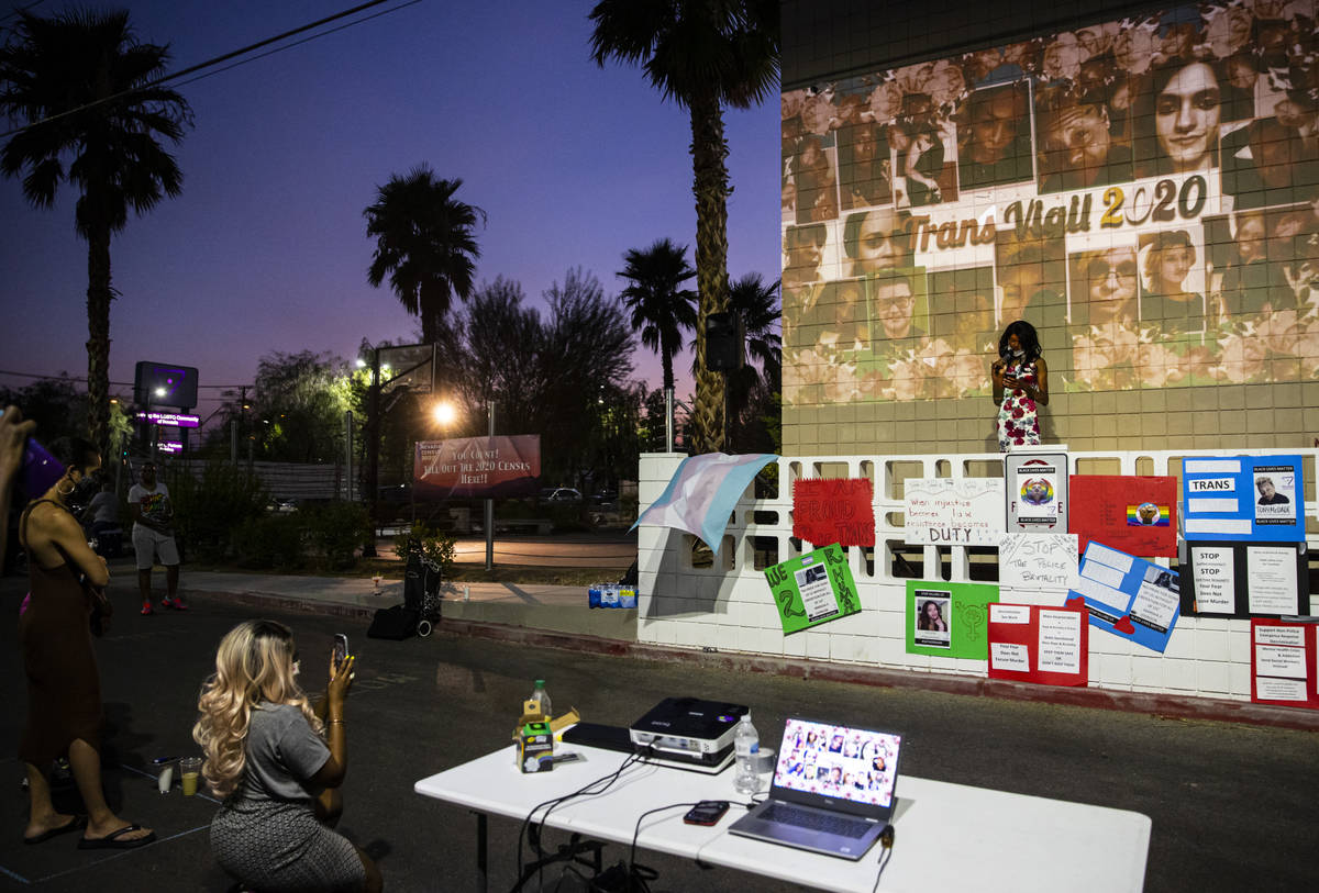 Event organizer Chrystal McKinley, right, speaks during a candlelight vigil, in remembrance of ...