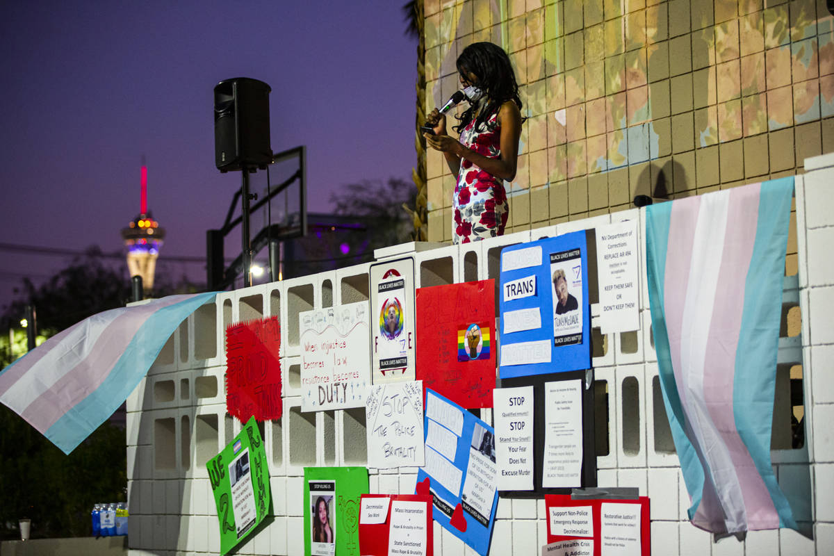 Event organizer Chrystal McKinley speaks during a candlelight vigil, in remembrance of the blac ...