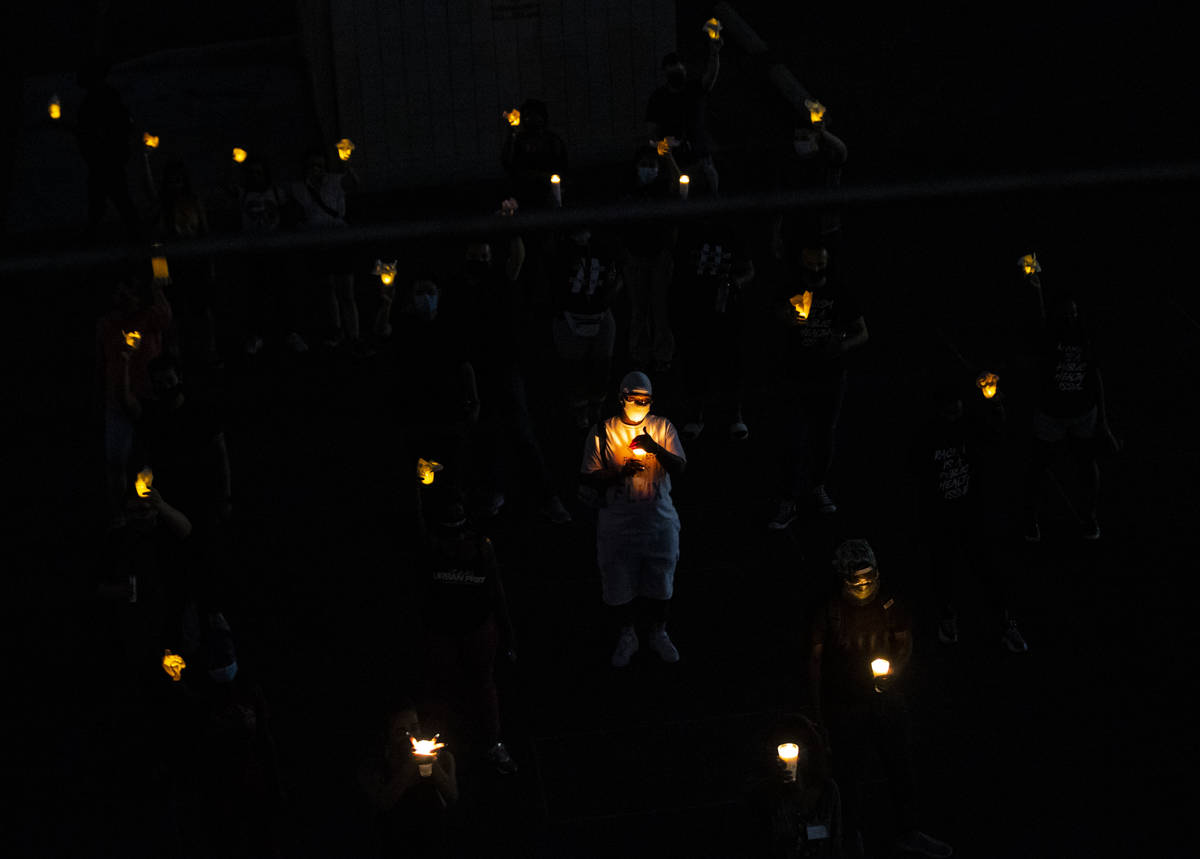 People form the transgender symbol, in remembrance of the black trans men and women killed so f ...