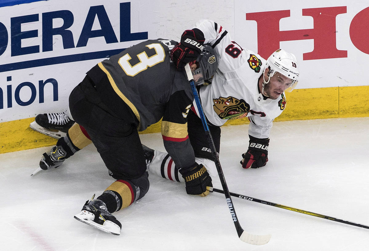 Vegas Golden Knights' Brayden McNabb (3) and Chicago Blackhawks' Jonathan Toews (19) battle dur ...