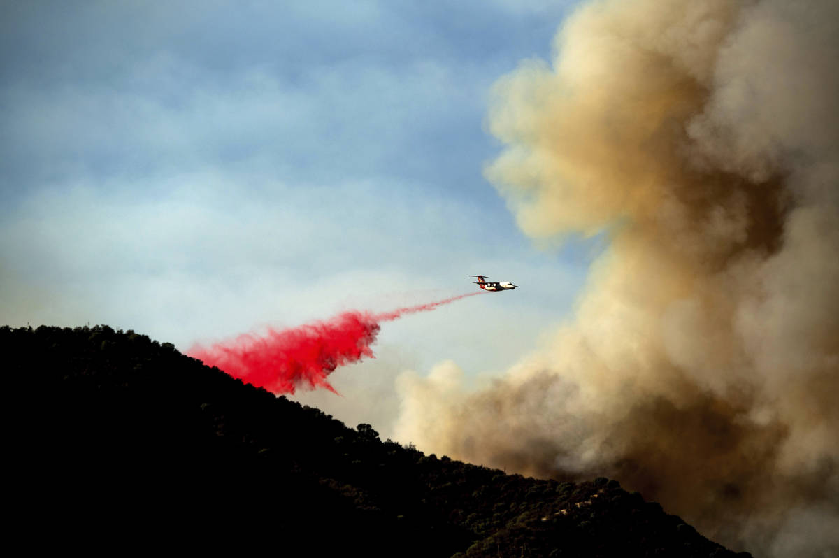 An air tanker drops retardant as the Lake Fire burns in the Angeles National Forest north of Sa ...