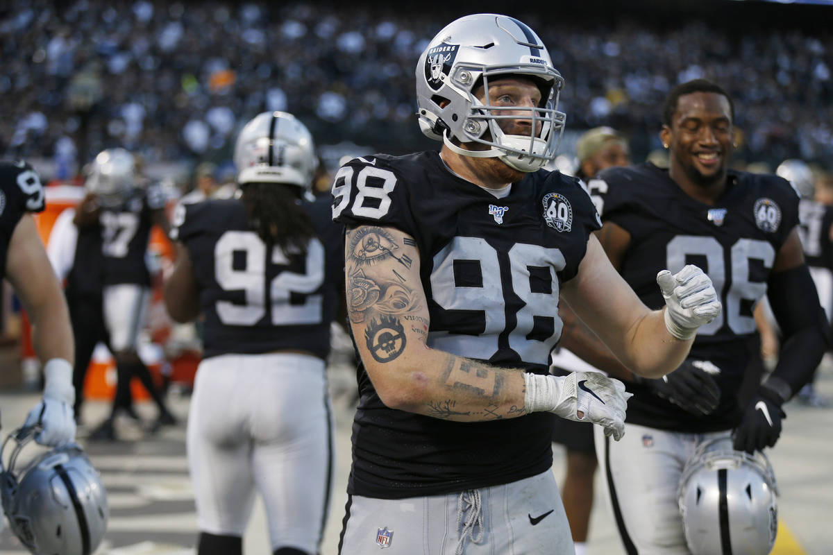 Oakland Raiders defensive end Maxx Crosby (98) on the bench during the second half of an NFL fo ...