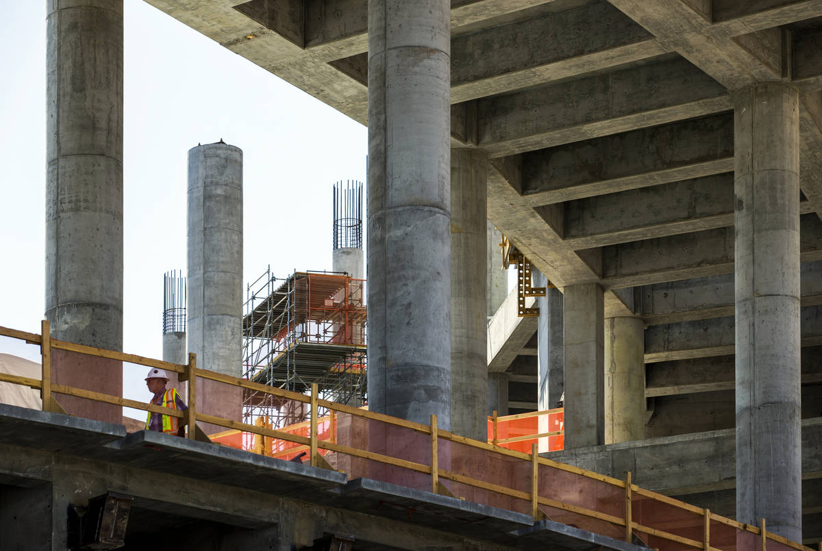 A single worker walks about the MSG Sphere at The Venetian construction site as it remains dorm ...