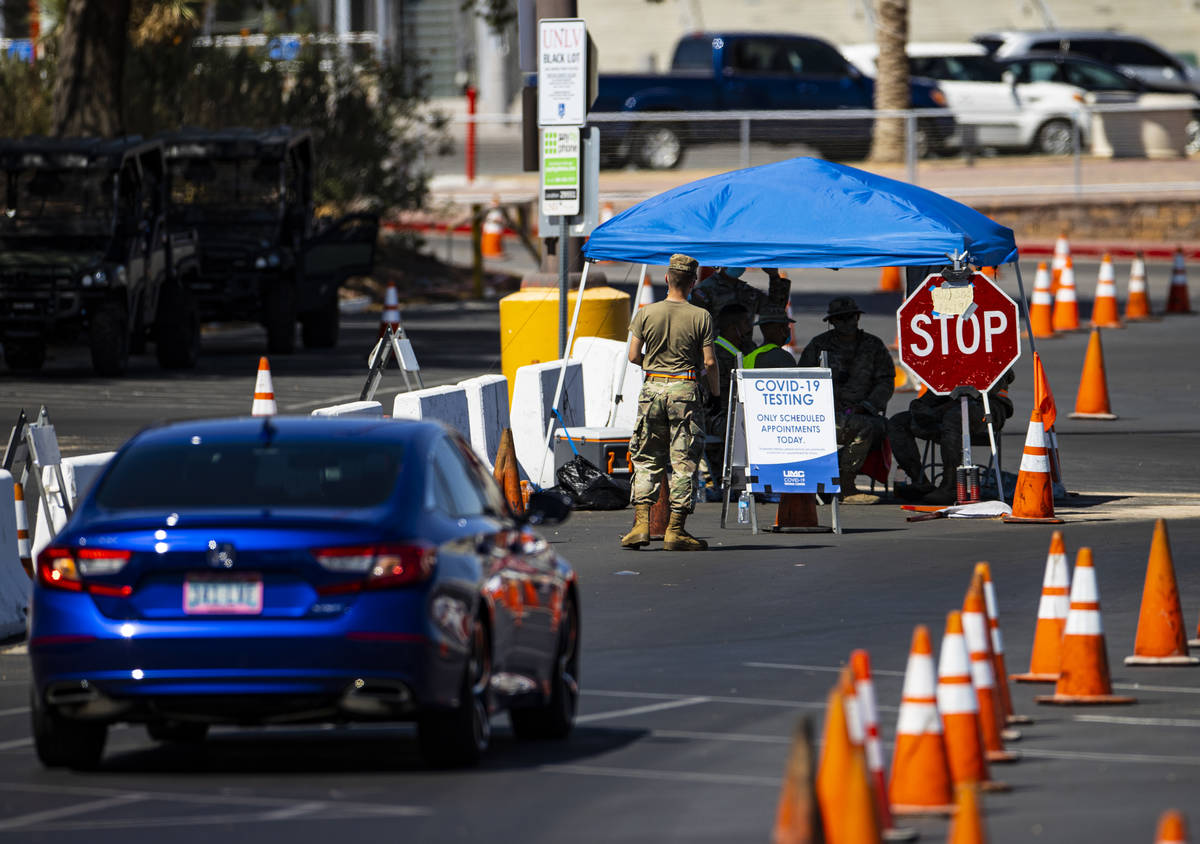 People line up at the UNLV coronavirus testing site in Las Vegas on Thursday, July 16, 2020. (C ...