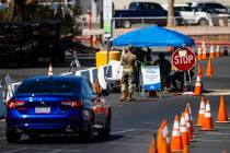 People line up at the UNLV coronavirus testing site in Las Vegas on Thursday, July 16, 2020. (C ...