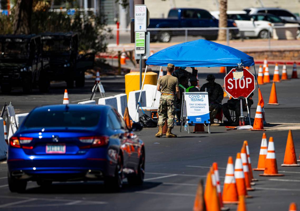 People line up at the UNLV coronavirus testing site in Las Vegas on Thursday, July 16, 2020. (C ...