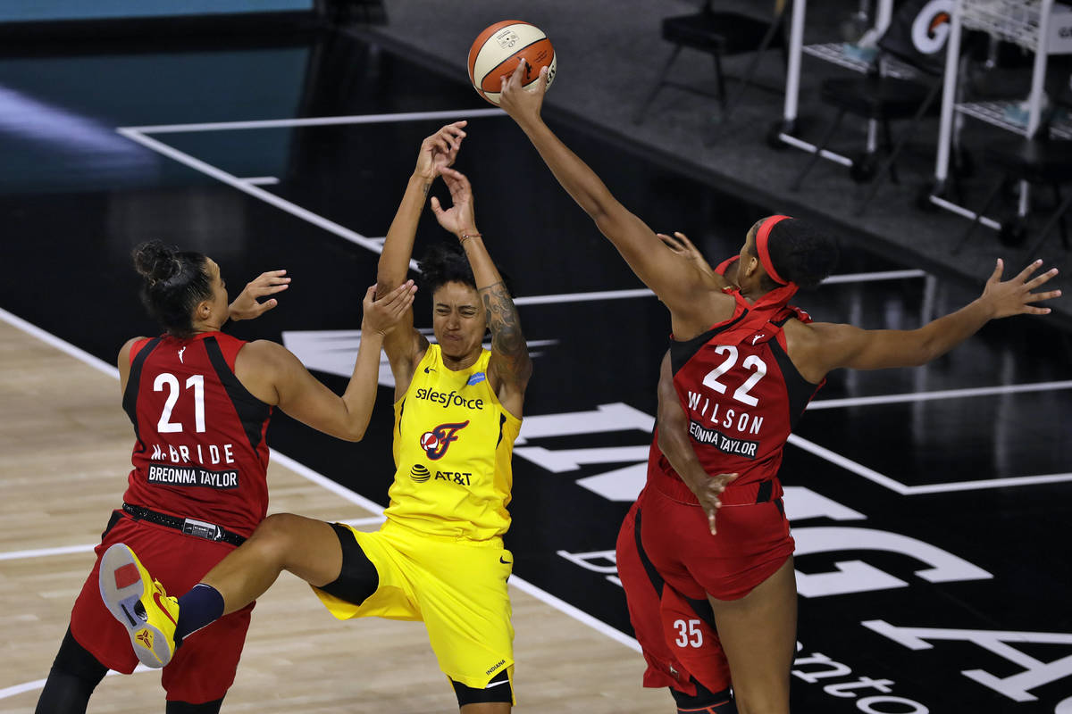 Indiana Fever forward Candice Dupree (4) loses the ball against Las Vegas Aces guard Kayla McBr ...
