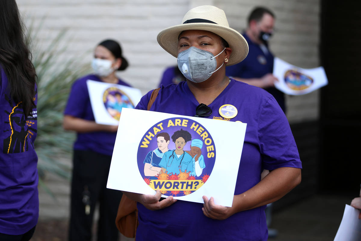 SEIU Local 1107 HCA health care worker Zabia Norman stands outside of the Nevada Division of Pu ...