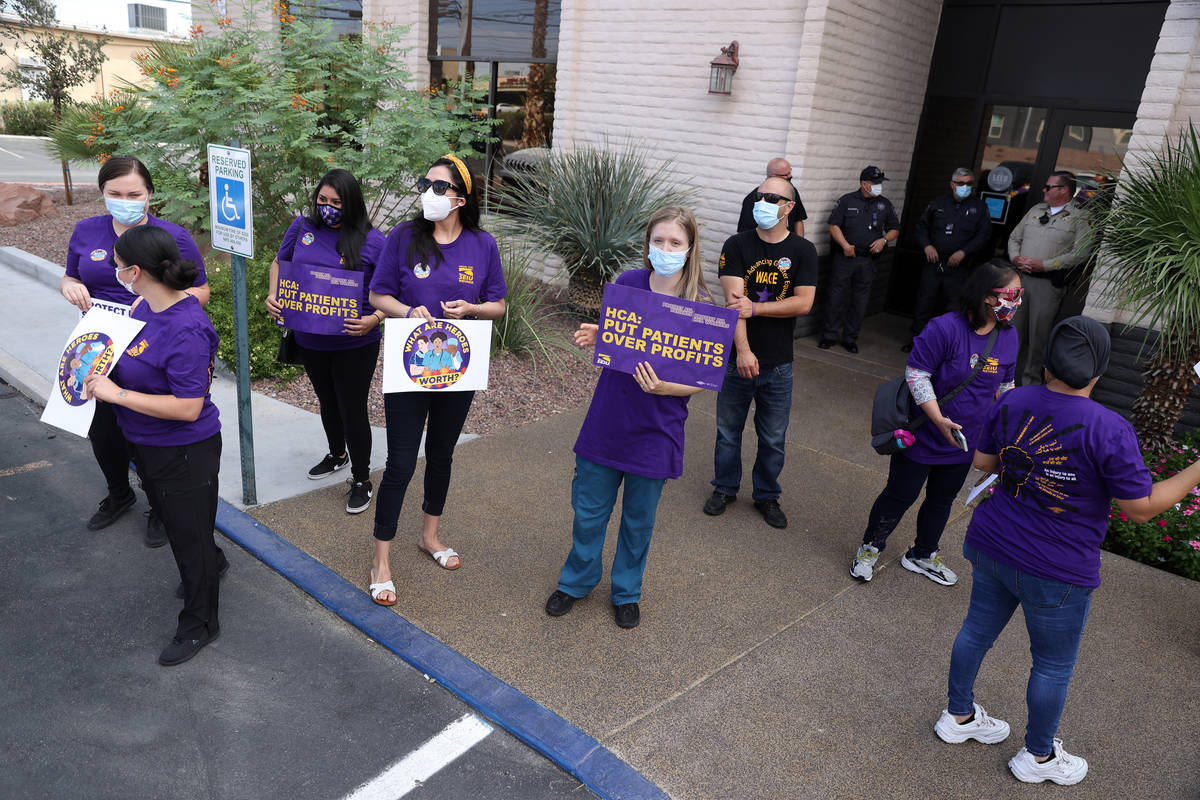 SEIU Local 1107 HCA health care workers stand outside of the Nevada Division of Public Health b ...