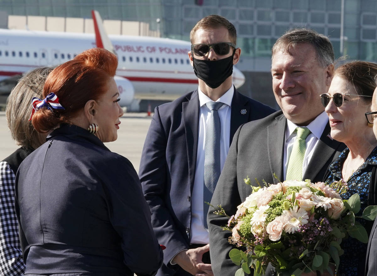 US Secretary of State Mike Pompeo, second right, and his wife Susan talk with US Ambassador to ...