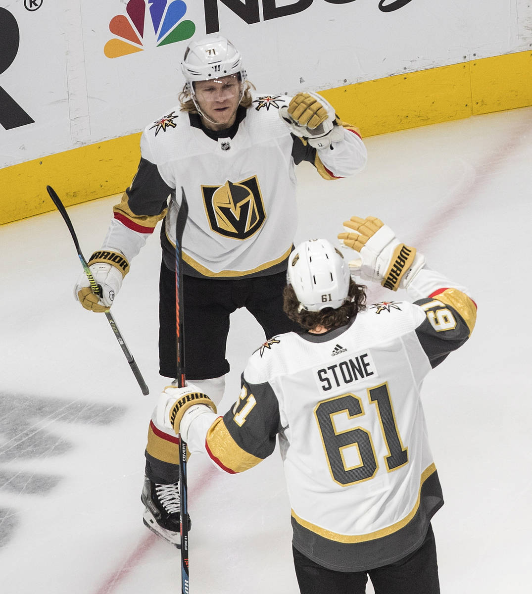Vegas Golden Knights' William Karlsson (71) and Mark Stone (61) celebrate a goal against the Ch ...