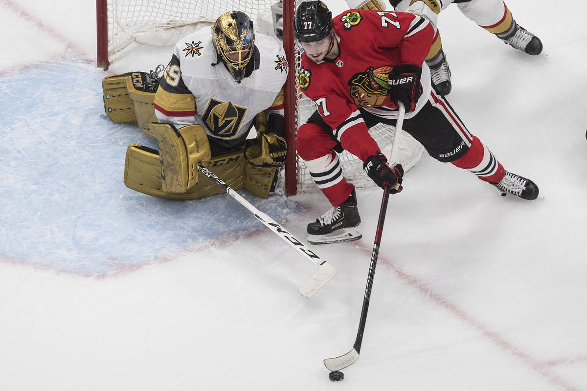 Vegas Golden Knights goalie Marc-Andre Fleury (29) watches as Chicago Blackhawks' Kirby Dach (7 ...