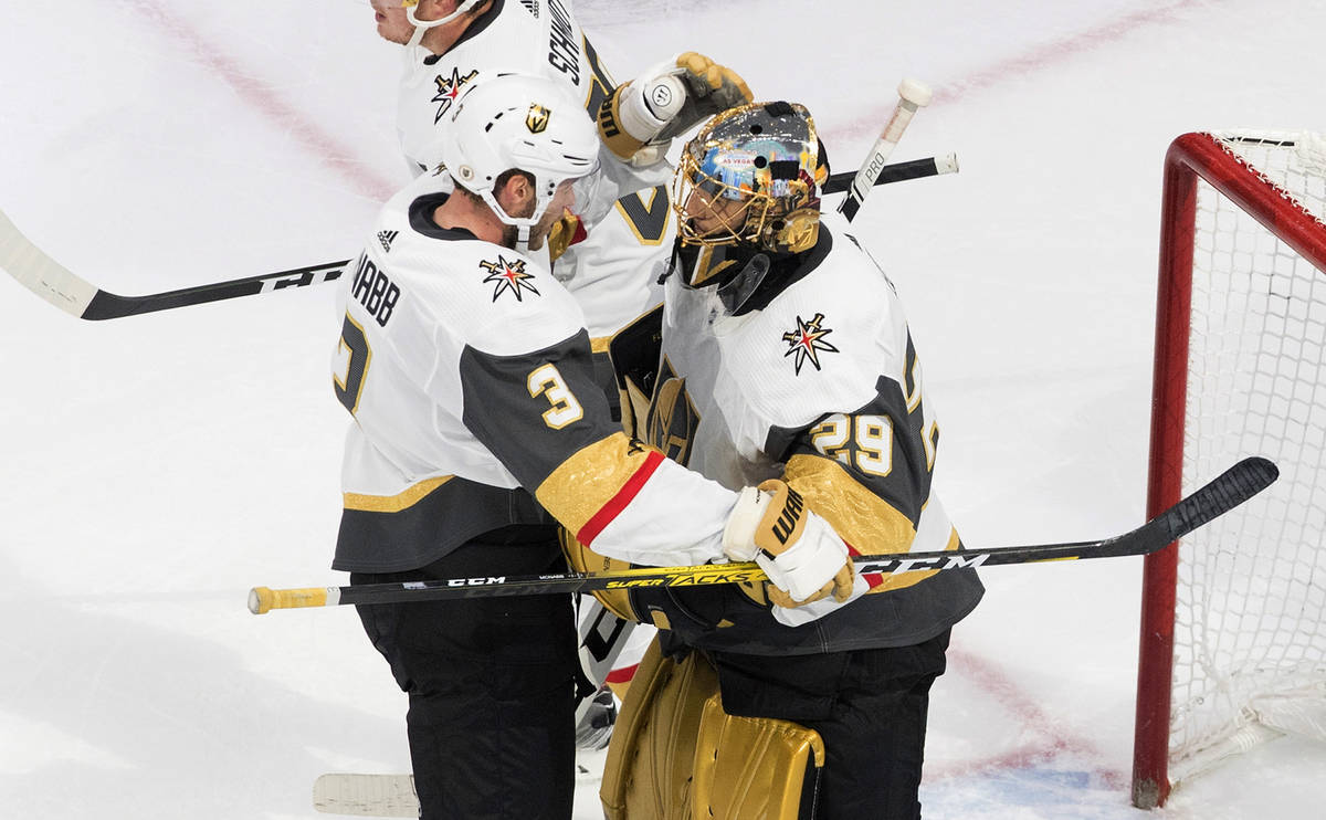 Vegas Golden Knights' Brayden McNabb (3) and goalie Marc-Andre Fleury (29) celebrate the win ov ...