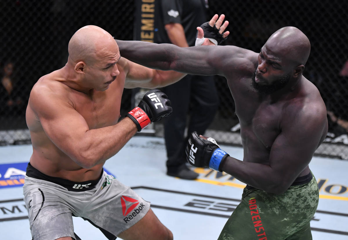 LAS VEGAS, NEVADA - AUGUST 15: (R-L) Jairzinho Rozenstruik of Suriname punches Junior Dos Santo ...