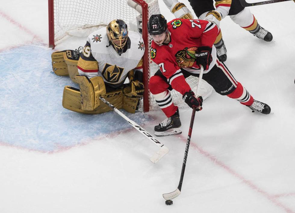 Vegas Golden Knights goalie Marc-Andre Fleury (29) watches as Chicago Blackhawks' Kirby Dach (7 ...