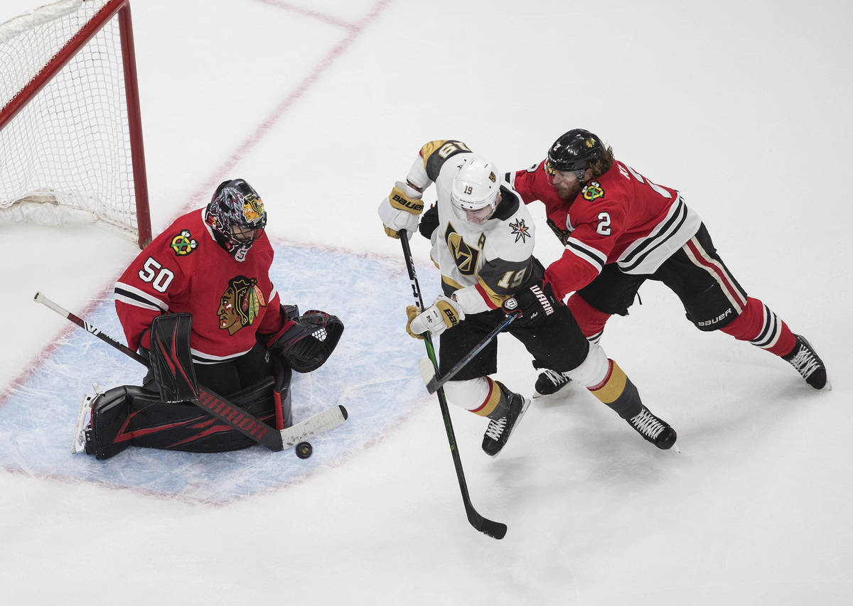 Vegas Golden Knights' Reilly Smith (19) is stopped by Chicago Blackhawks goalie Corey Crawford ...