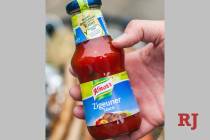 FILE- In this May 6, 2014 taken photo a man holds a bottle of "gypsy sauce" from the manufactur ...
