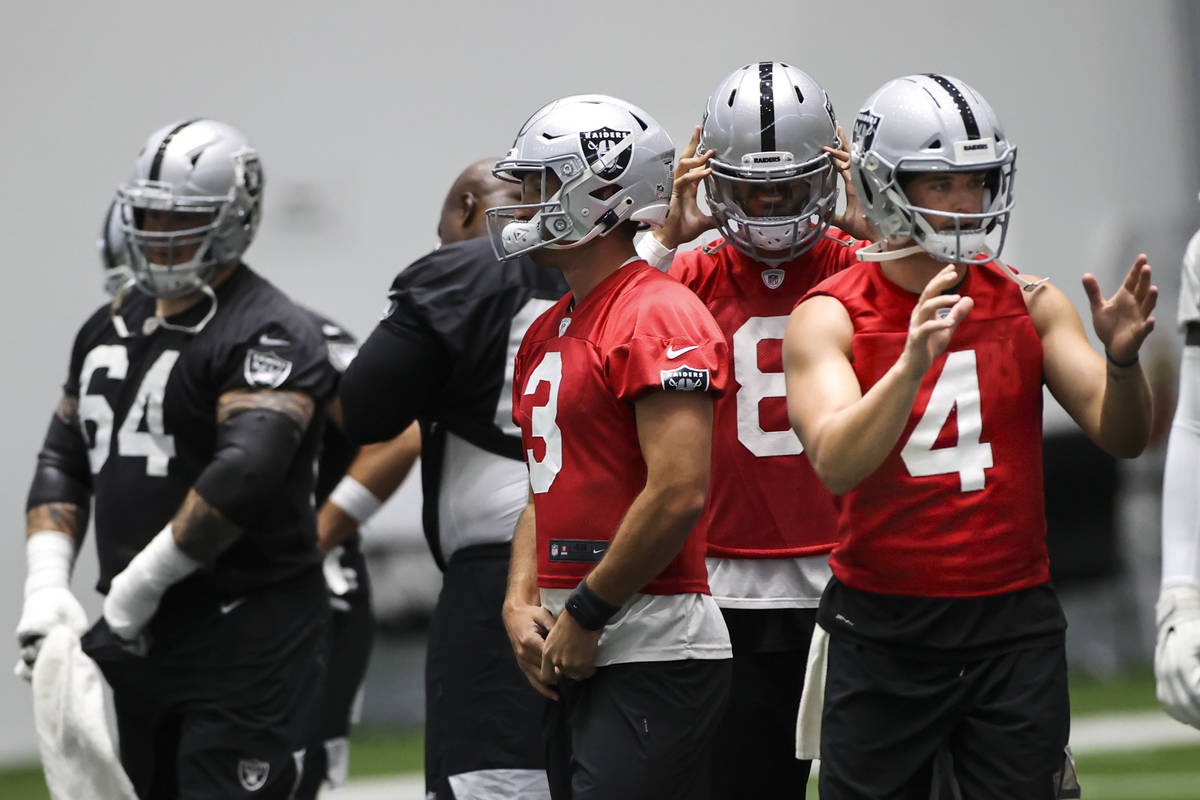 Las Vegas Raiders quarterbacks Nathan Peterman (3), Marcus Mariota (8) and Las Vegas Raiders qu ...