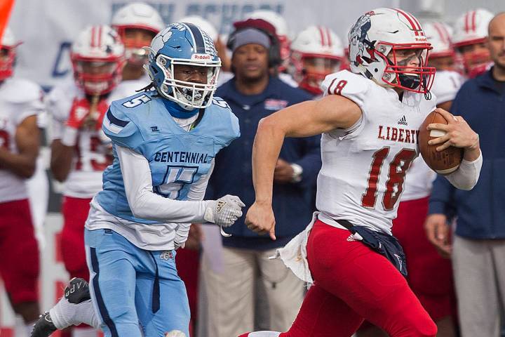 Liberty junior quarterback Daniel Britt (18) breaks a big run down the sideline past Centennial ...