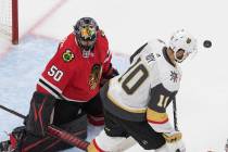 Vegas Golden Knights' Nicolas Roy (10) looks for the rebound off Chicago Blackhawks goalie Core ...