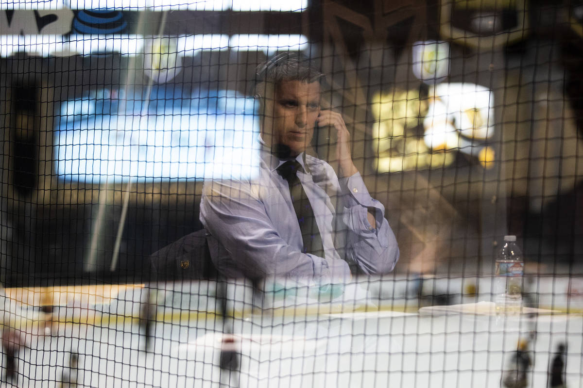Vegas Golden Knights pregame show host Daren Millard is reflected in the window while he answer ...