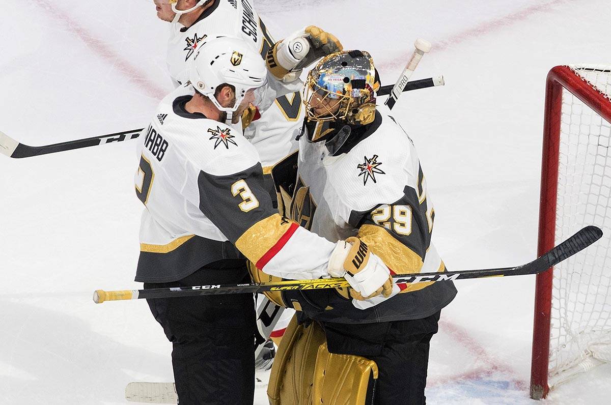 Vegas Golden Knights' Brayden McNabb (3) and goalie Marc-Andre Fleury (29) celebrate the win ov ...