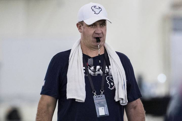 Houston Texans head coach Bill O'Brien runs a drill during an NFL training camp football practi ...