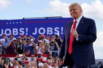 President Donald Trump arrives to speak at a campaign rally at Wittman Airport, Monday, Aug. 17 ...