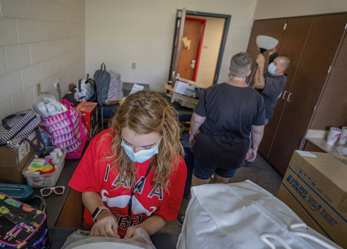 UNLV freshman Amanda Nowak, 18, of Henderson, unpacks her dorm room with the help of her parent ...