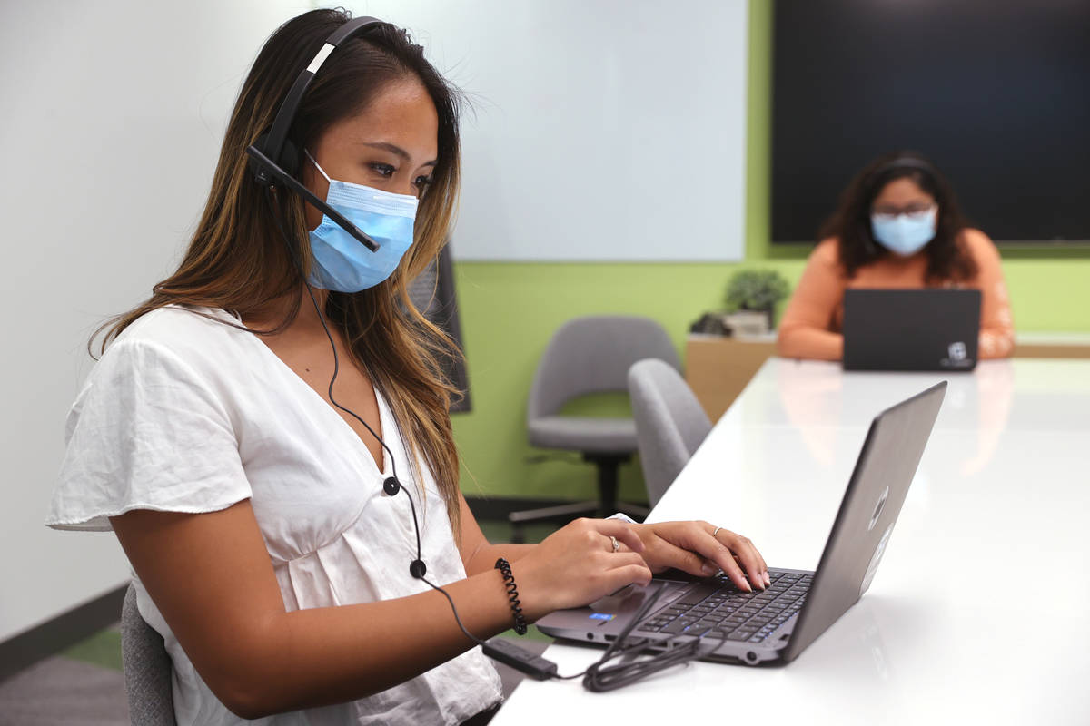 UNLV School of Public Health students Ashlen Ramit, left, and Yareli Romualdo work on COVID-19 ...