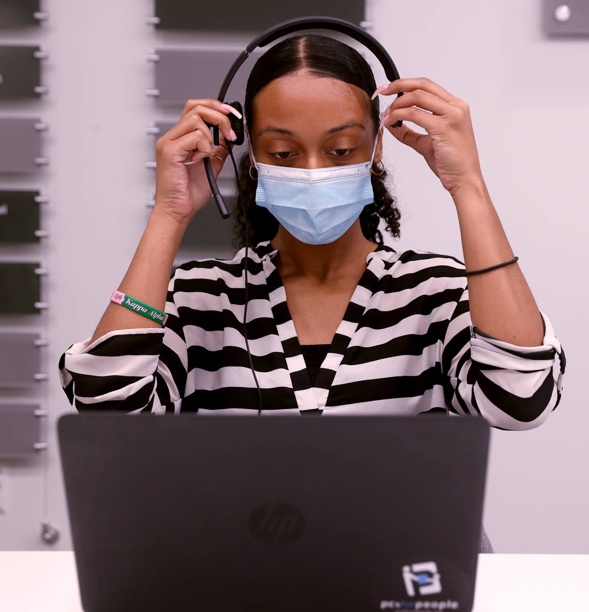 UNLV School of Public Health student Alanna Johnson works on COVID-19 contract tracing Thursday ...