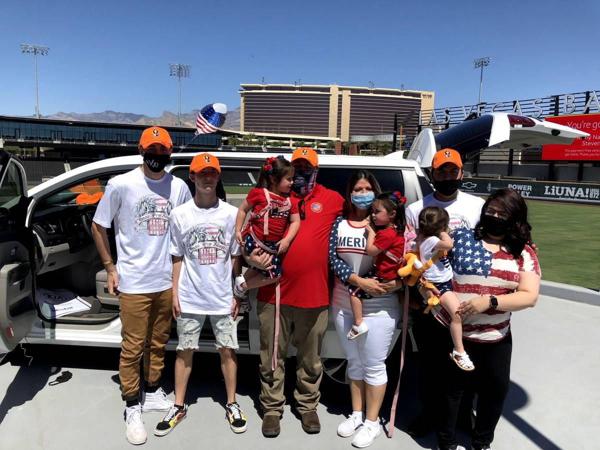 Retired Army National Guard specialist Steven Stanley and his wife, Christine, center, are surr ...