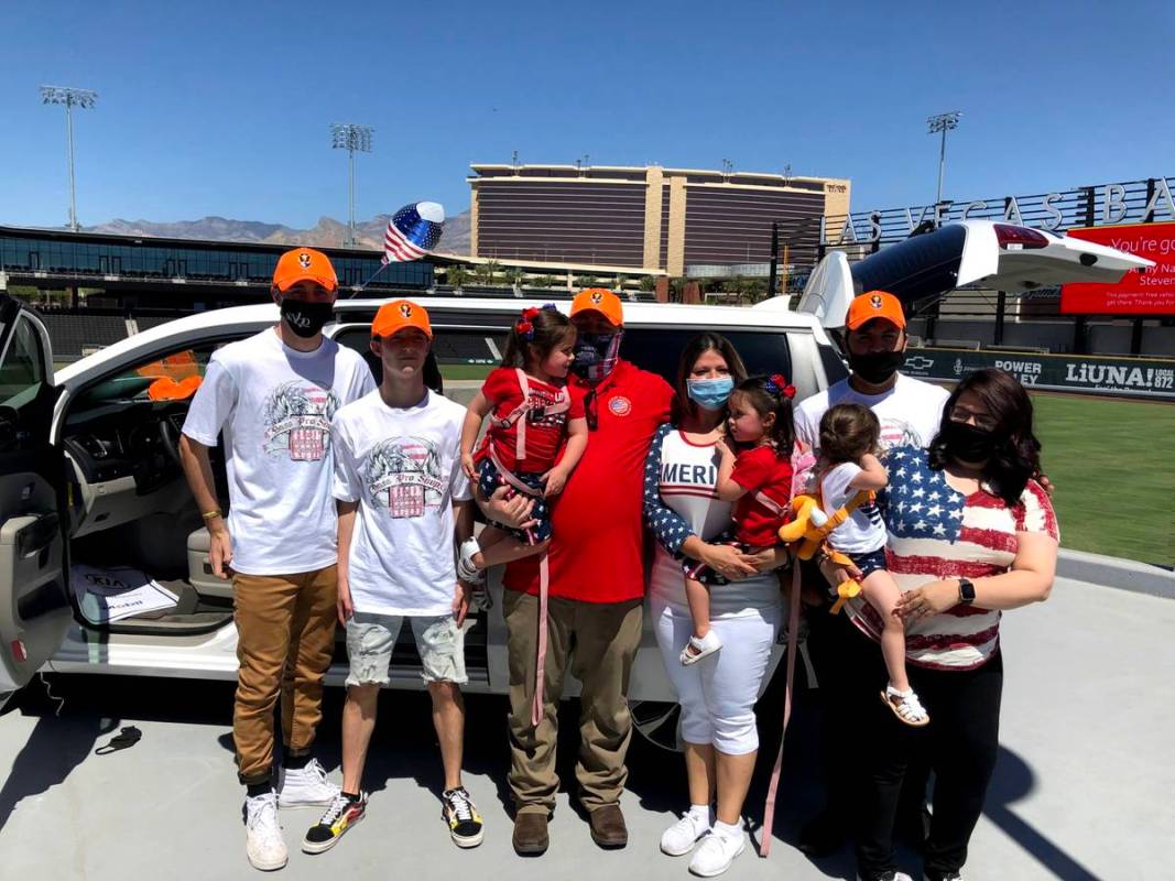 Retired Army National Guard specialist Steven Stanley and his wife, Christine, center, are surr ...