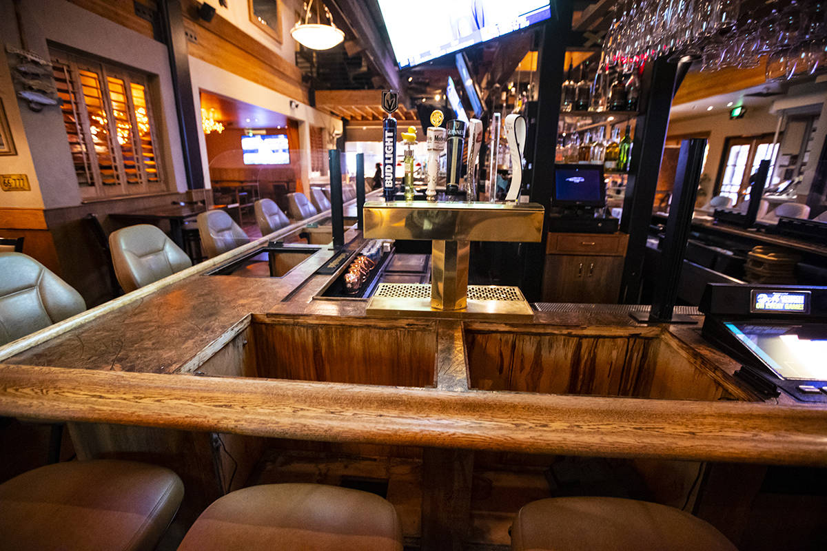 Empty spaces at the bar where bartop gaming machines formerly were at Black Mountain Grill in H ...