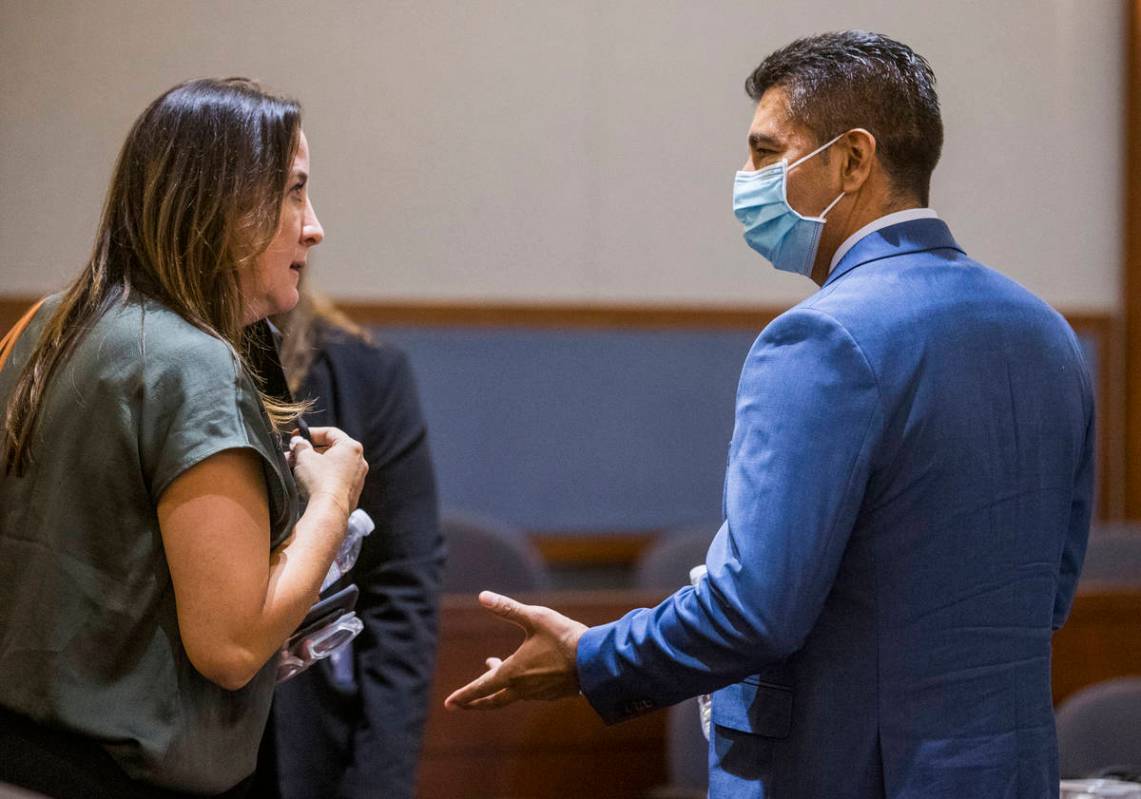 Attorney Kristina Wildeveld, left, talks in court with defendant Adolfo Orozco during a prelimi ...