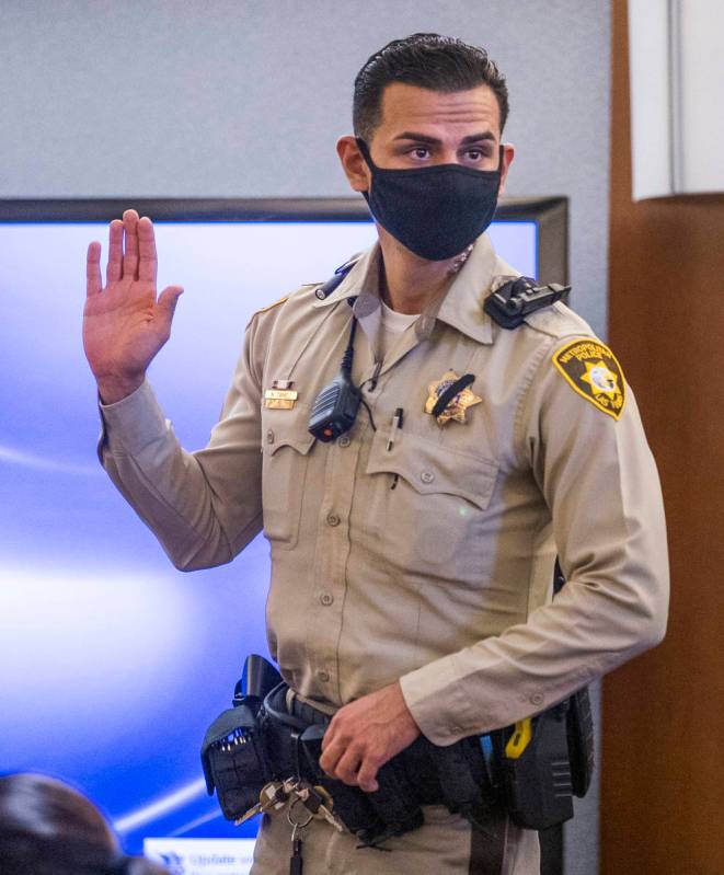 Metro officer Nolan Daniel is sworn in as a witness during a preliminary hearing for Adolfo Oro ...