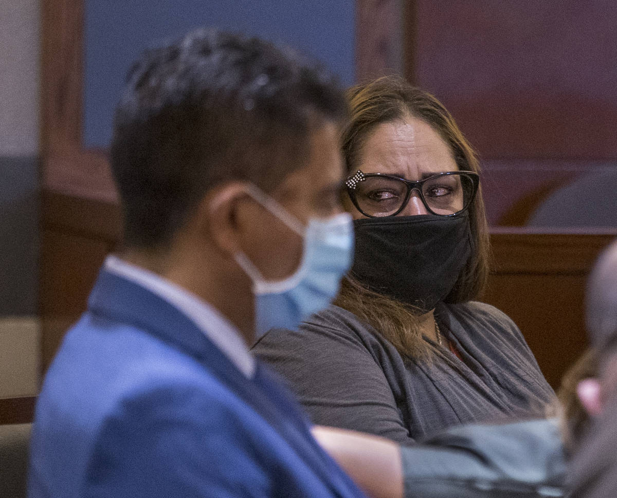 Defendant Malinda Mier, right, cries in court while viewing photos of victims during a prelimin ...
